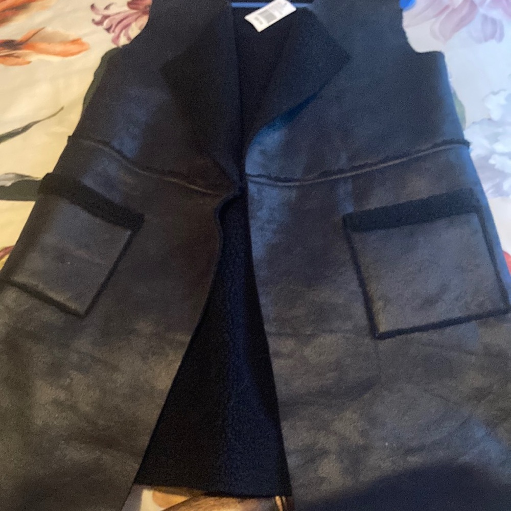 NWT Wonderful, warm and sleek black vest! Synthetic leather.